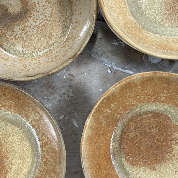 Four amber-glazed bowls from above