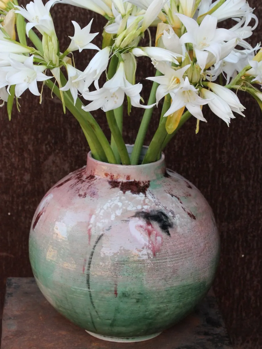 Close detail of a Touches vase with white lilies
