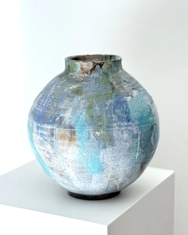 A turquoise blue Touches vase